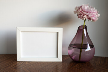 frame with place for text, flower decoration in a vase.