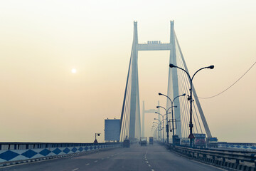 Obraz premium Vidyasagar Setu (Bridge) over river Ganges, 2nd Hooghly Bridge in Kolkata,West Bengal,India. Shot in winter morning. Connects Howrah and Kolkata, Longest Cable - stayed bridge in India.