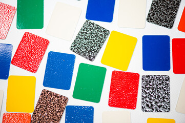 Aluminum profile section with color samples. Powder coating services