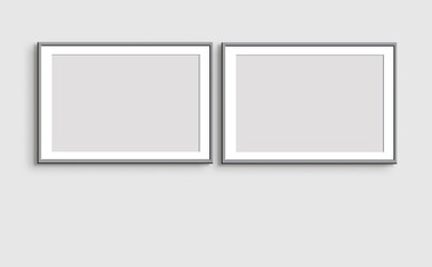 Two horizontal gray frames on a light gray wall. Mockup of poster frames. Art show. A minimalist mockup. - 510664318