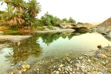 the place is beautiful , with mountains, rocks , small fish