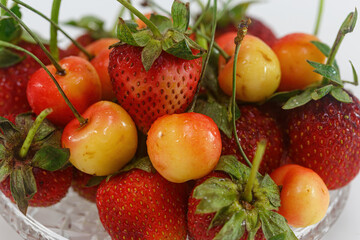 Strawberries with cherries close-up