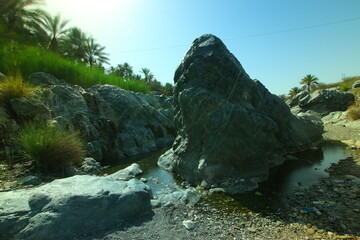 the place is beautiful , with mountains, rocks , small fish