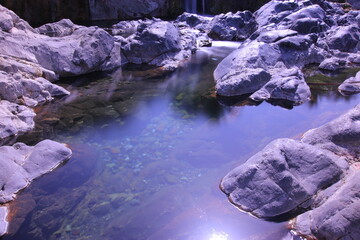 the place is beautiful , with mountains, rocks , small fish