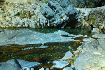 the place is beautiful , with mountains, rocks , small fish