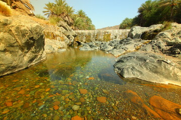 the place is beautiful , with mountains, rocks , small fish