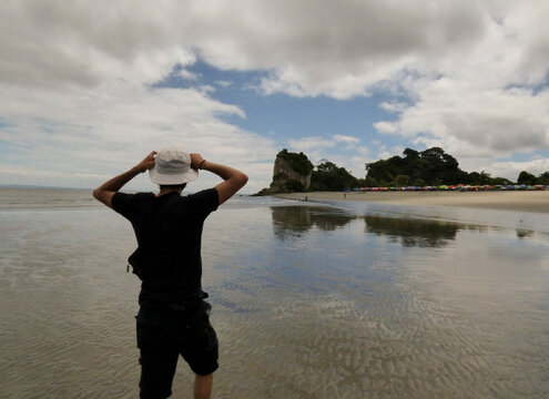 Young man walking to the bay of Morro (Tumaco-Colombia)