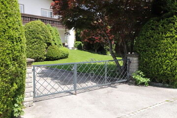 a new house with a driveway gate 