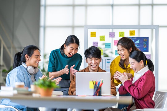 Young Happy Asian Business Man, Woman Work Together, Celebrate Clap Hands In Start Up Office. Creative Team Brainstorm Meeting, Businesspeople Colleague Partnership Or Office Coworker Teamwork Concept