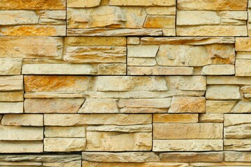Background, texture wall decorated with imitation of natural sandstone
