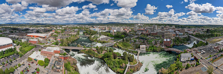 Fototapeta na wymiar Spokane, WA skyline cityscape panorama with pavilion and Spokane River during the day, United States