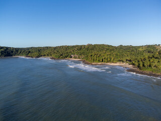 Aerial view of a deserted paradise beach amidst the nature of the Atlantic Forest