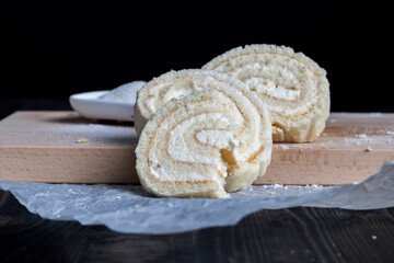 a rolled roll of soft cake and sweet curd filling