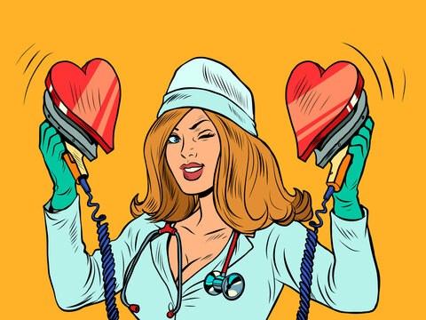 Defibrillator. The nurse resuscitates the heart. Love romance, valentine symbol