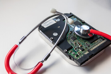 Red stethoscope with internal hard disk drive hdd contains health record and sensitive patient data...