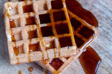 square sweet soft waffles in bee honey