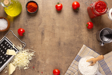 Pizza ingredients on table. Bread recipe homemade at tabletop background