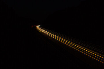 car driving on the highway headlights streaking