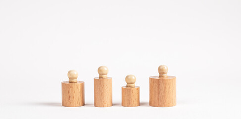 Montessori knobbed cylinders row of different size and height. Social diversity concept in abstract style . High quality photo