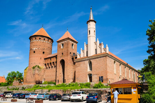 Reszel, Poland - June 12, 2022: Castle and the Church of the Holy Apostles Peter and Paul in historic town Reszel, Poland