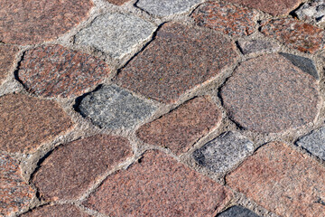 a road made of stones and cobblestones in the old style