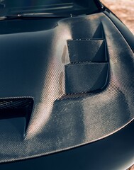 Aftermarket carbon fiber car hood with vents