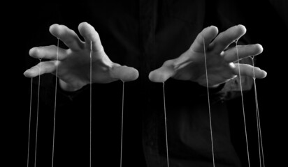 Man hands with strings on fingers. Negative abusive relationship, manipulation, control, power...