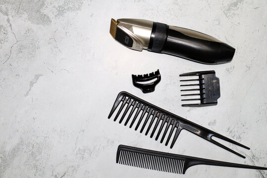 Professional tools for a barber shop on a gray background.