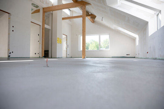 freshly cured concrete screed on construction site in loft in a family house