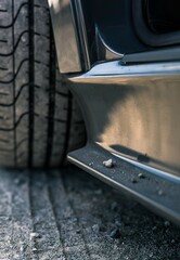 Obraz premium Car side skirt with rocks resting on the skirt