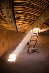 The sun shines in the entrance to the floor of a ceremonial kiva as part of Pecos National Historical Park near Santa Fe, New Mexico.