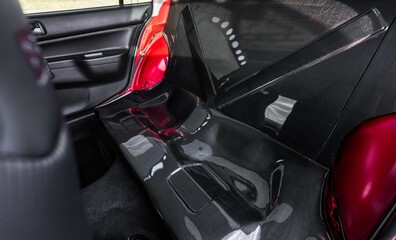 Rear seat delete replaced with carbon fiber in a four door car