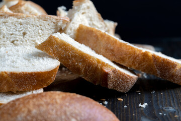 sliced loaf of bread on a cutting wooden board