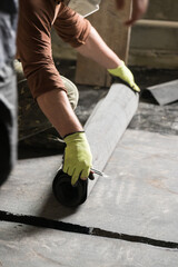 Waterproofing and resin on the floor, installation of waterproofing on concrete screed.