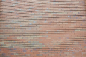 Fototapeta premium Beautiful brick wall background. Decorative facing brick. Modern finishing building materials.