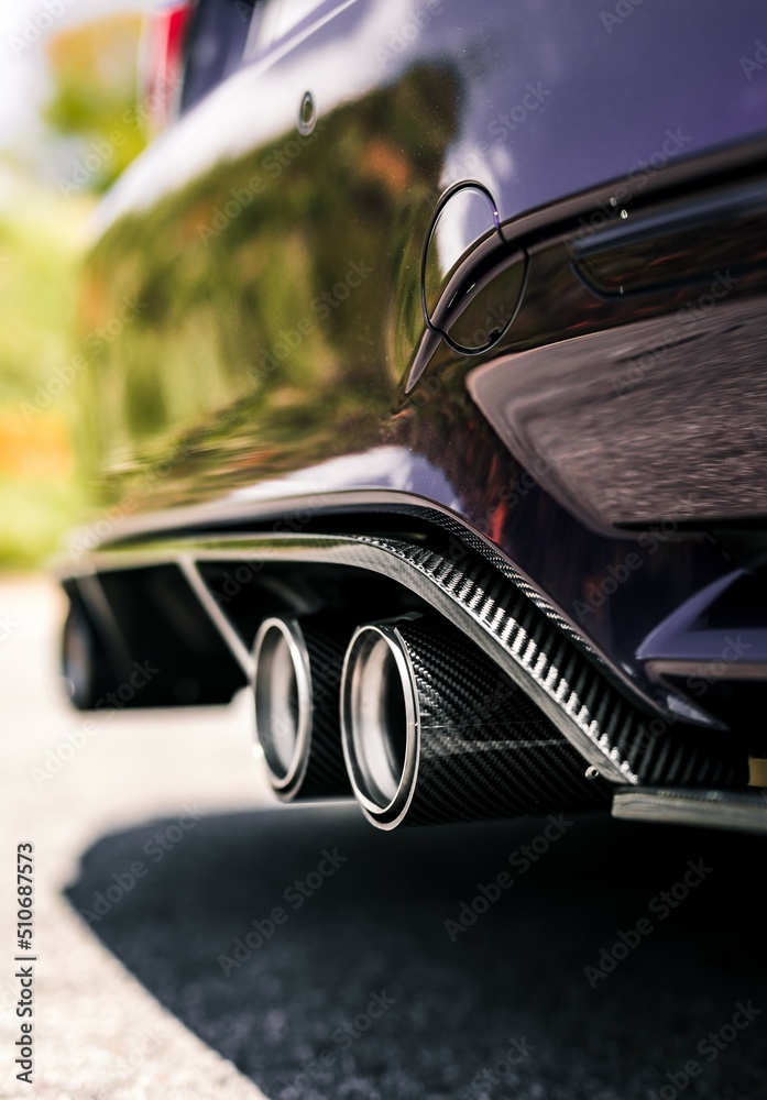 Canvas Prints Quad exhaust pipes on a purple car with carbon fiber accents