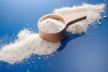 Measuring cup with washing powder