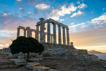The Temple of Poseidon at Cape Sounion at sunset, over the Aegean Sea, Greece