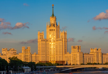 Fototapeta na wymiar Kotelnicheskaya Embankment Building (one of seven Stalin skyscrapers) and Moskva river at sunset, Moscow, Russia