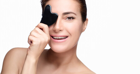 Skincare and Anti Aging concept. Smiling naked woman with smooth glowing healthy skin displaying a...