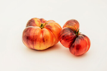 Ripe pink tomatoes on white background