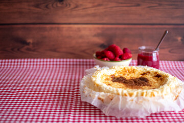 Traditional cheesecake with fresh raspberries. copyspace