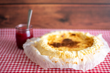 Traditional cheesecake with raspberry jam.