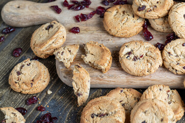 delicious dried cookies made of high-quality flour with dried red cranberries on the table