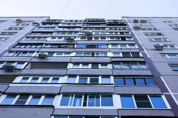 Fototapeta premium Windows of an apartment building, bottom view, selective focus