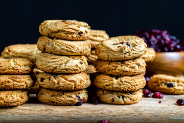 delicious dried cookies made of high-quality flour with dried red cranberries on the table