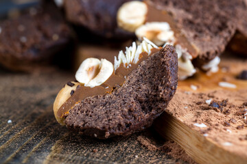 multicomponent cake made of caramel and nuts in chocolate