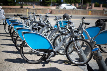Obraz premium public shared bicycles with advertising space located in the middle of the street