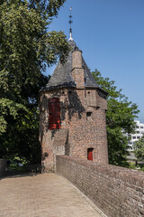 Fototapeta na wymiar Picturesque medieval Monnikendam - water gate was built around 1420 as part of the second city wall from 1380 - 1451. The gate consists of two towers connected by an arch. Amersfoort, the Netherlands.