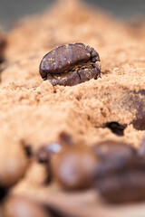 roasted coffee beans on the table , close up